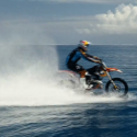 Motocross star surfs big waves on his bike