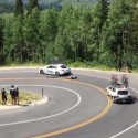 Cyclist racing downhill crashes into moving car